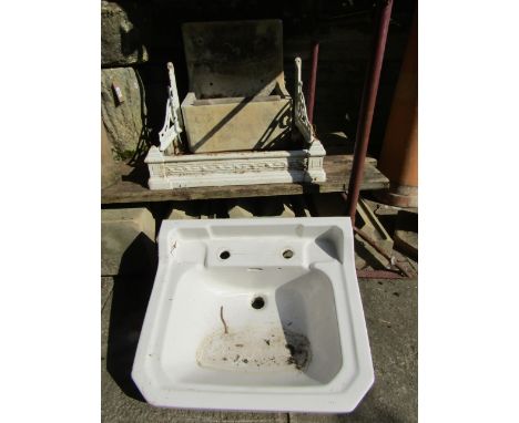 A reclaimed painted cast iron hand wash basin bracket associated sink and one other