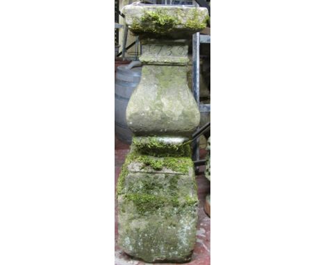A good George IV / William IV period carved sectional natural stone plinth, the frieze indistinctly inscribed above date ‘173