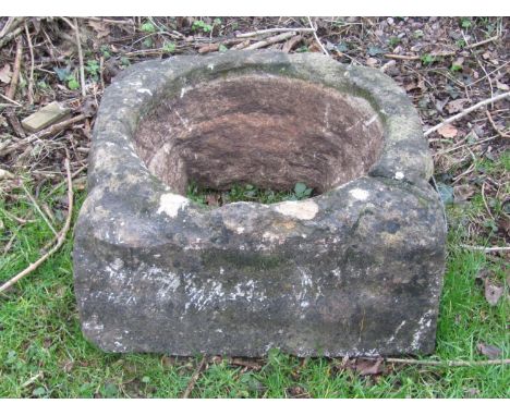 An antique weathered carved natural stone trough/drain cover with circular interior approximately 30 cm high x 60 cm square (
