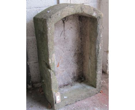 A weathered natural stone D-end / demi-lune planter / trough, with single drainage hole, 27cm high, 77 x 46cm.