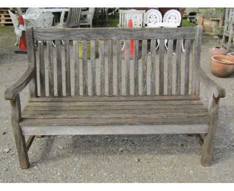 A Bridgman weathered (silvered) teak three seat  garden bench with curved slatted seat and back, 153 cm wide
