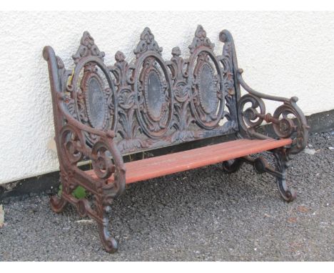 A novelty miniature model cast iron framed garden bench with planked teak seat, 29cm high, 41 x 20cm.