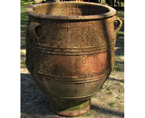 A weathered moss encrusted Mediterranean terracotta jar with three moulded loop handles and banded detail (af) 67cm high x 52