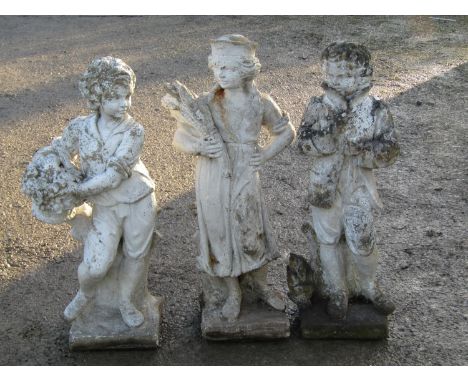 A set of three painted and weathered cast composition stone  garden figural ornaments depicting summer, autumn and winter 76 