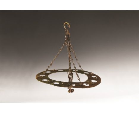 6th-7th century AD. An iron polycandelon, or chandelier, in the form of a ring with eleven holes to accept conical-shaped oil
