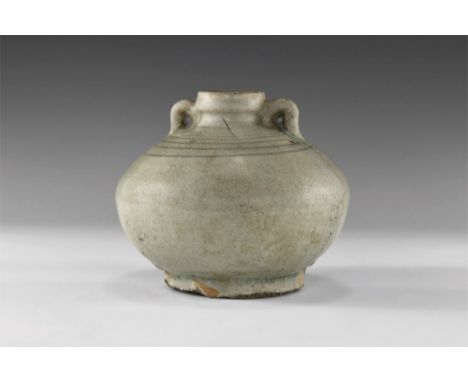 14th-16th century AD. A green glazed Sangkhalok Celadon ware vase with narrow mouth and ridged spout, two small handles to th