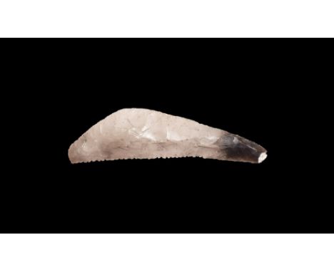 Neolithic, 5th-2nd millennium BC. A knapped bifacial sickle knife in a grey-brown translucent flint with curved back and ribb