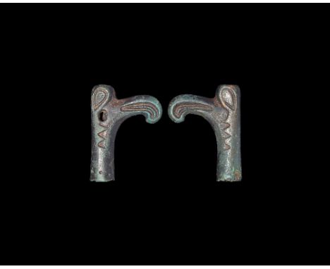 10th-12th century AD. A bronze tubular finial formed as a raven with hooked beak, piriform eyes. 33 grams, 46mm (1 3/4"). Fro