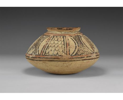 Late 3rd-early 2nd millennium BC. A polychrome ceramic biconvex jar with everted rim, band of painted ornament to the shoulde