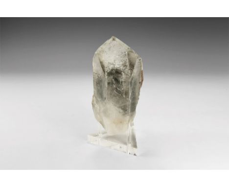 A single crystal of quartz exhibiting numerous phantoms, formed when the pyramidal termination faces accumulate bubbles or gr
