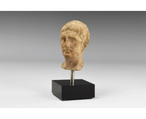 1st century AD. A ceramic bust of a member of the Julio-Claudian dynasty, possibly Augustus Caesar, mounted on a custom made 