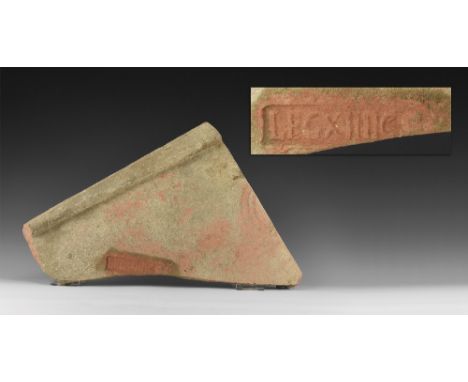 1st century BC-5th century AD. A large ceramic roof tile with raised lip to one end and stamped with LEGIO XIIII and traces o