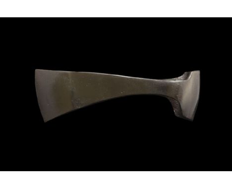 10th-12th century AD. An iron axehead with narrow blade, curved edge, extension to rear of the socket. 755 grams, 18cm (7"). 