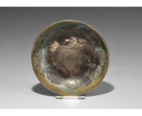 6th-9th century AD. A broad dish with chamfered rim, punched-point motif to the inner face of a bird with collar and triangul