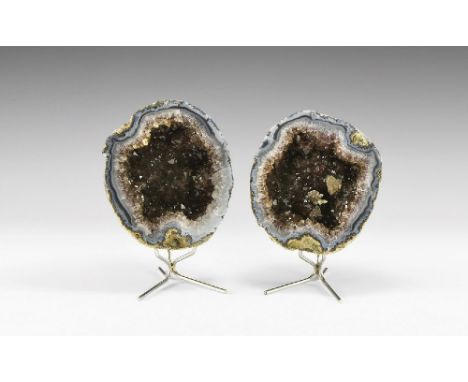 A fine pair of blue agate geodes lined with dark, nearly smoky amethyst, one half with three interesting calcite overgrowths,