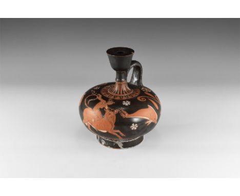 4th-3rd century BC.
A South Italian, Apulian jug with drum-shaped spout tapering to a thin neck with applied handle, neck pai