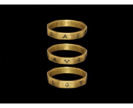 2nd century AD.
A nine-sided flat-section gold hoop, each facet with incised niello-filled seriffed capital letter 'DASAVGLOT