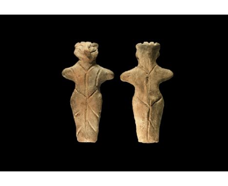 Neolithic, 6th-4th millennium BC. A ceramic figurine of a standing female with prominent nose, arms extended, incised detail 