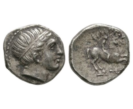 359-336 BC. Obv: head of Apollo right, hair bound with taenia. Rev: FILIPPOY above youth on horseback prancing right, trident