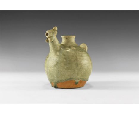 13th-16th century AD. A green glazed Sangkhalok Celadon ware vase with narrow mouth and neck; globular body with applied fan 