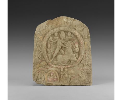 1st-4th century AD. A stone plaque with arched top and flat base; in the centre a wreath enclosing the image of Mithras weari