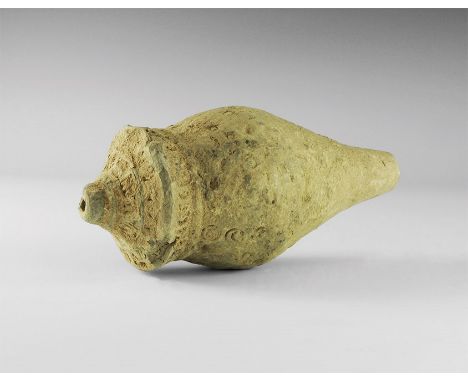9th-11th century AD. A hollow ceramic vessel with a thick conical nozzle, piriform body with stepped shoulder. 614 grams, 19c