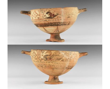 5th-3rd century BC. A ceramic skyphos footed cup with lateral loop handles and flared foot; green surface to the inner face w