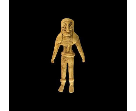 Circa 2700 BC. A ceramic figurine of a standing male with large lentoid eyes, large nose and incised eyebrow; wearing a cape(