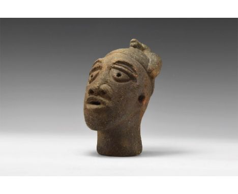Nok Culture, 500 BC-300 AD. A hollow-formed ceramic head with crested cap and tassel. 432 grams, 14cm (5 1/2"). From an impor