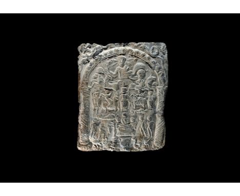 2nd-4th century AD.
A lead plaque with figures relating to the Danubian rider cult in three registers within an arched frame,