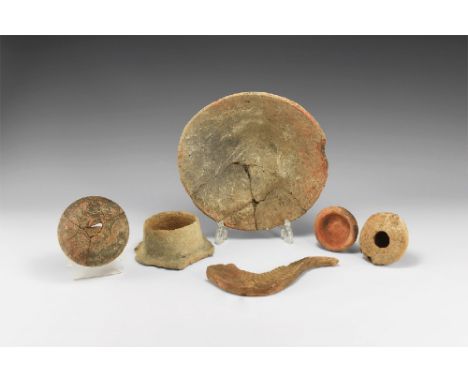 1st-4th century AD. A group of ceramic items comprising: a large conical bowl; small decorated cup; small dish; oil lamp; sta