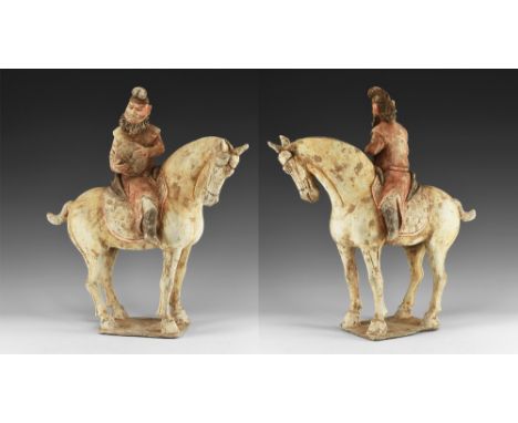 Tang Dynasty, 618-907 AD. A ceramic figure of a horse with painted details to the face and body; foreign rider with painted d