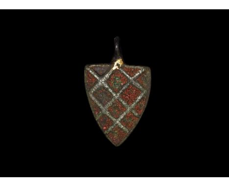 14th-15th century AD. A gilt cast heater shield harness pendant depicting diamonds inlaid with red enamel; with suspension lo