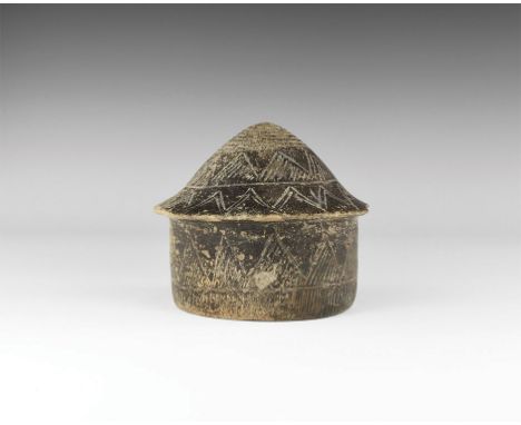 4th-3rd millennium BC. A burnished blackware hut model or lid, with vertical sidewall and sub-conical upper face; bands of ha