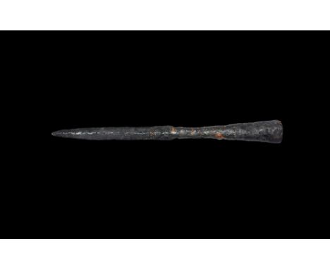 8th-9th century AD. An iron spearhead with broad tapering closed socket, narrow shoulder, slender lozenge-section parallel-si