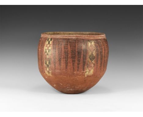 1st millennium BC. A broad ceramic bowl with rolled rim, painted band of triangular panels filled with zigzag ornament, recta