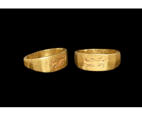 2nd century AD.
A substantial octagonal gold hoop with intaglio motif of clasped hands. 7.08 grams, 20mm overall, 16.29mm int