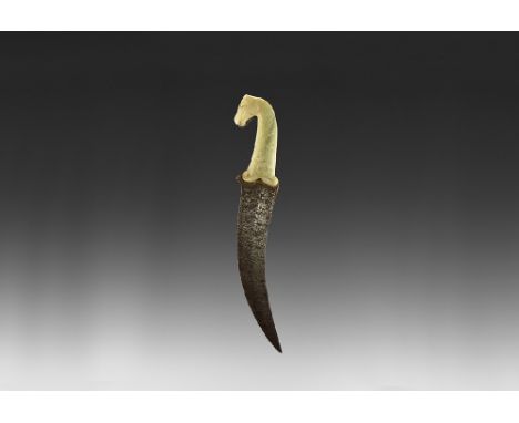 Mughal, 18th-19th century AD. The curved double-edged steel blade with central ridge, the hilt of pale green stone (jade?"). 