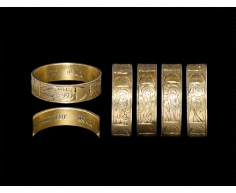 15th-16th century AD. A silver-gilt band ring engraved with four panels depicting Christ crucified, St Barbara, St Catherine 