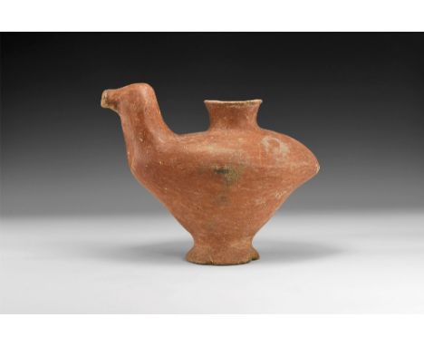 1st millennium BC. A hollow ceramic vessel formed as a bird on a circular flared base and flared nozzle to the back. 926 gram