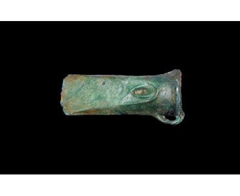 11th-9th century BC. A bronze looped and socketted axe head with flared edge, collar to mouth and indented Omega shape to bot