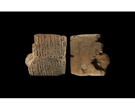 Late 3rd millennium BC. A large part of pillow-shaped ceramic tablet fragment with bands of cuneiform text to one broad face 