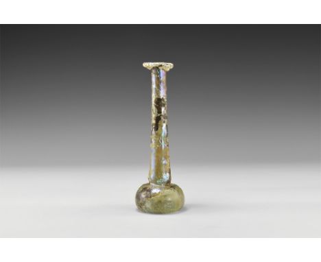 1st-3rd century AD. A glass unguentarium with silvery iridescence, bulbous body with dimple base, tapering stem, everted and 