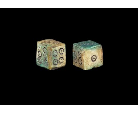 1st-3rd century AD. A pair of cuboid bone dice with ring-and-dot markings arranged 6:1, 5:2, 4:3. 2.53 grams total, 9mm (1/4"