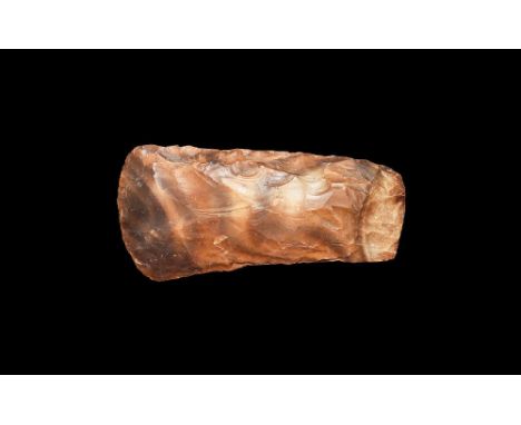 Neolithic, 4th-2nd millennium BC. A knapped handaxe with broad curved cutting edge and squared butt. 261 grams, 13cm (5"). Fr