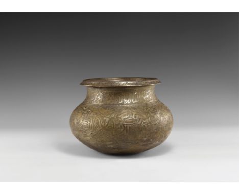 14th century AD. A squat bronze jar with rounded bottom, chamfered rim with stamped leaf design, bands of calligraphic text r
