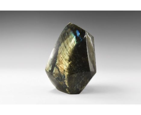 A large polished boulder of labradorite from Madagascar, with rich colour play on most faces, principally blues and golds. 2.