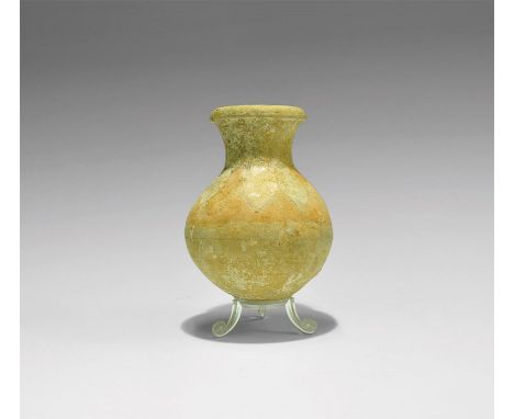 1st millennium BC. A spherical ceramic jar with funicular neck and rounded rim; ochre pigment to the shoulder with alternatin