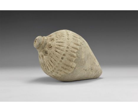 9th-11th century AD. A hollow ceramic vessel with a thick conical nozzle, piriform body with stepped rim and bands of stamped