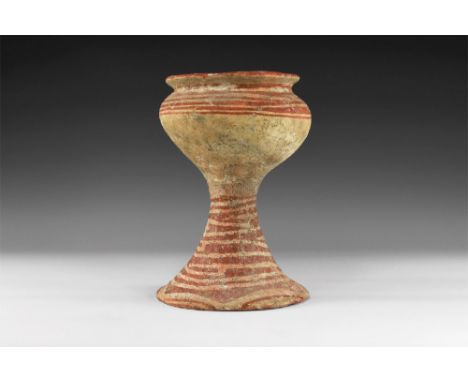 3rd-2nd millennium BC. A ceramic chalice-shaped vessel, possibly an incense burner, with narrow flared rim with red paint; gl